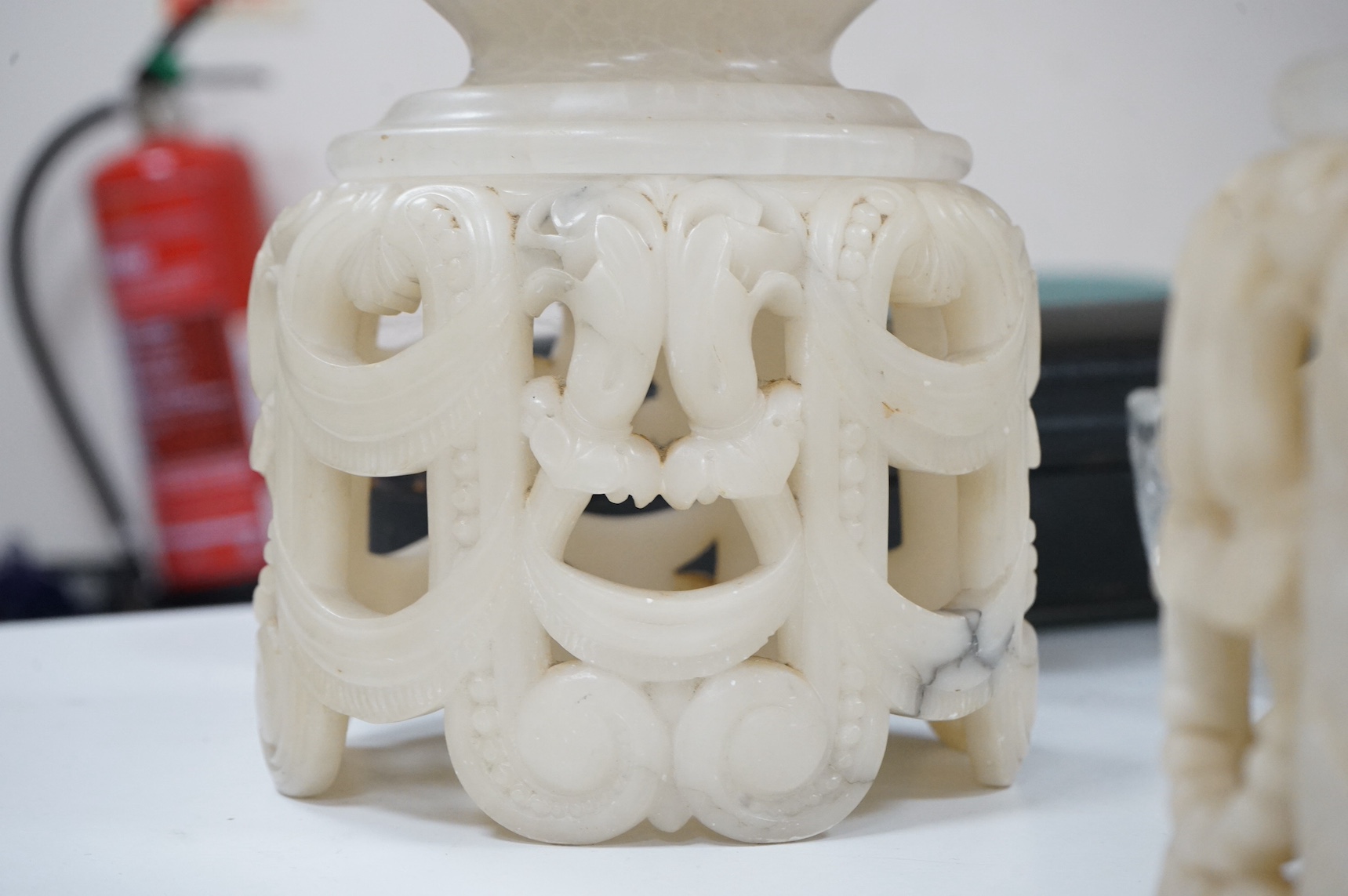 A pair of French Art Deco alabaster carved table lamps in a Chinese style, 42cm high. Condition - fair/good, untested